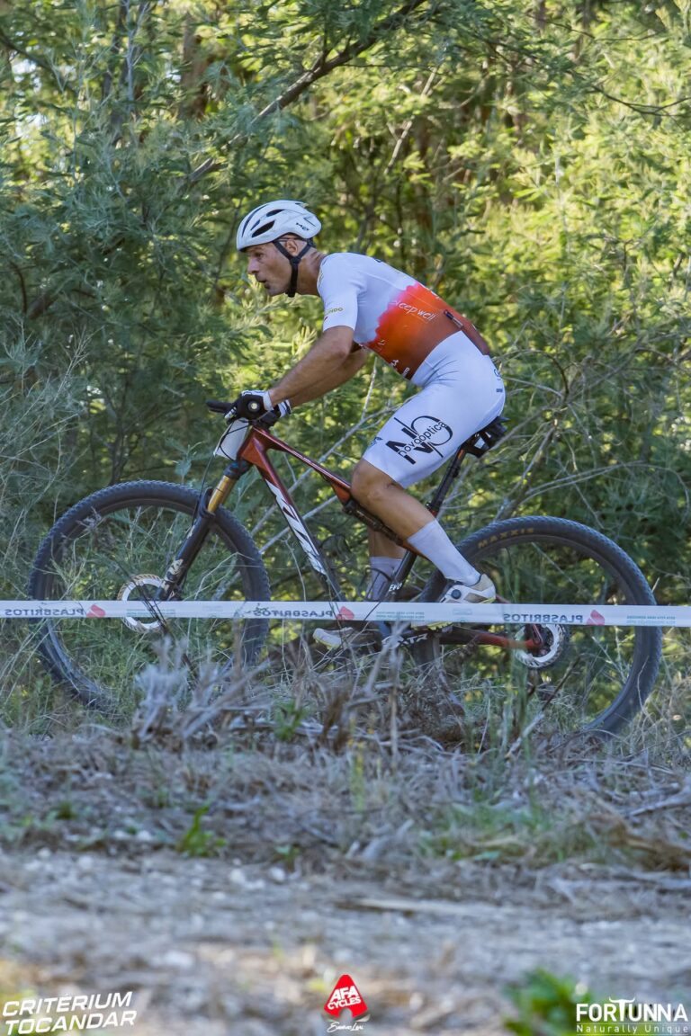 Hugo Xavier racing through the woods in an XCM event
