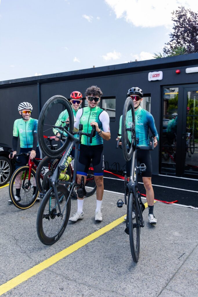 Cyclists lifting their bikes outside the Endurance Lab studio