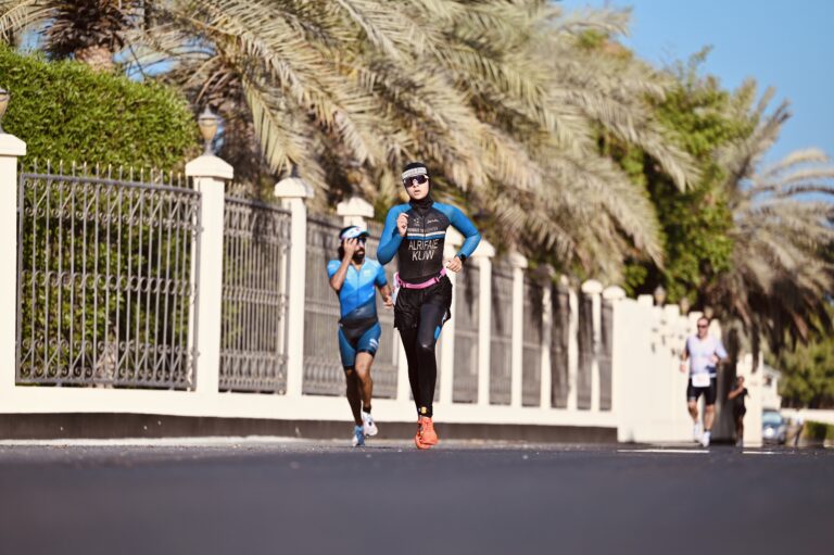 Lulwa Alrifaie running in a Kuwait trisuit during a triathlon